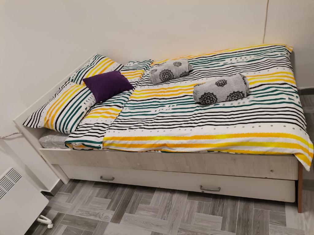 a bed with two stuffed animals on top of it at Apartment Marko in Zagreb