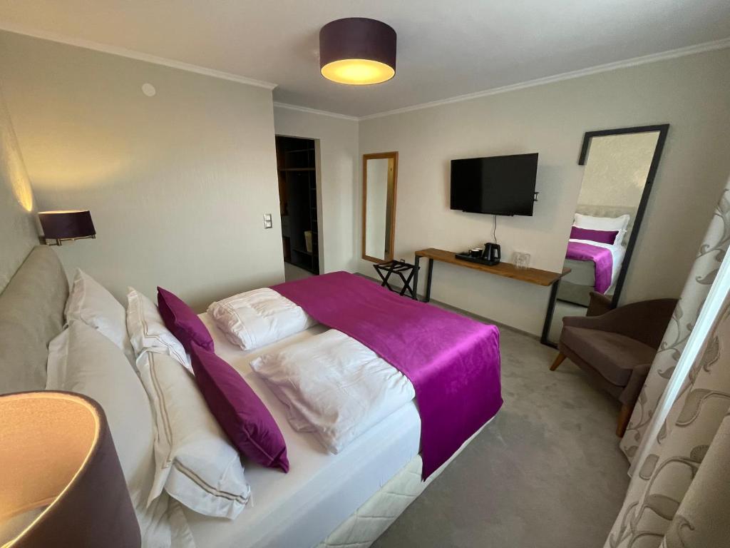 Rúm í herbergi á Hotel Radetzky