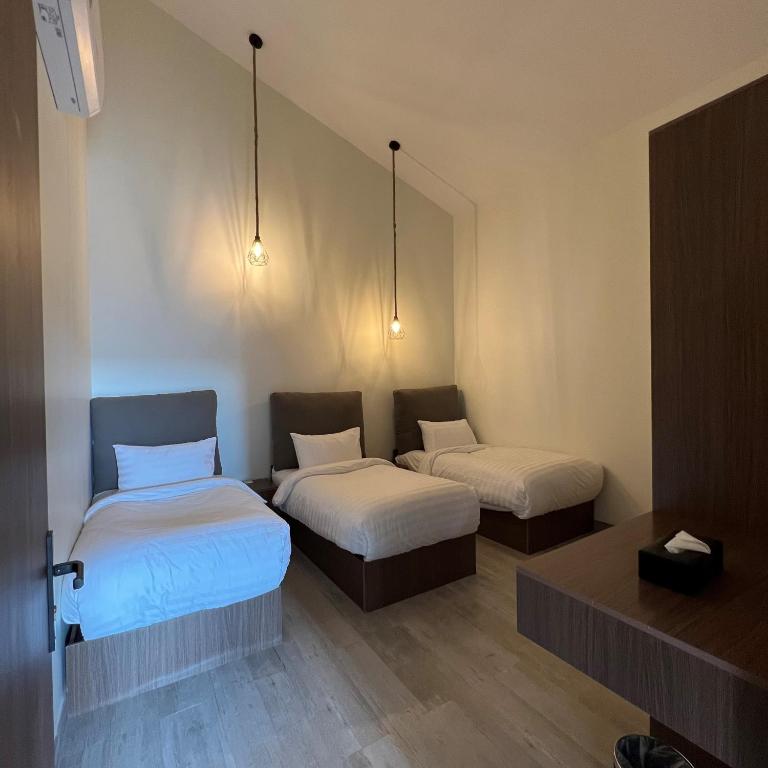Postel nebo postele na pokoji v ubytování اكواخ سنتارا الريفيه