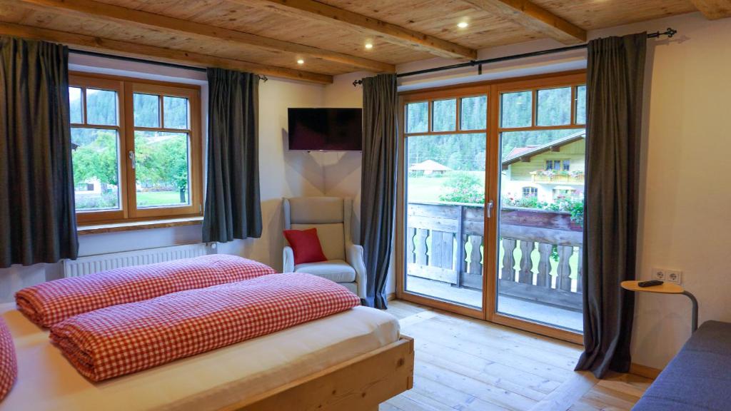 Postel nebo postele na pokoji v ubytování Haus Petra