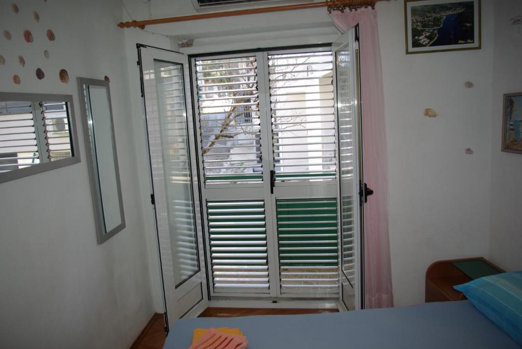 Postel nebo postele na pokoji v ubytování Rooms Tia