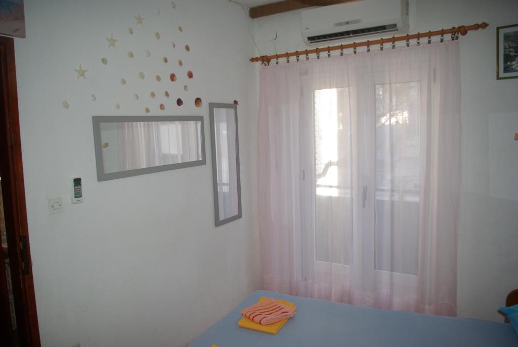 Postel nebo postele na pokoji v ubytování Rooms Tia
