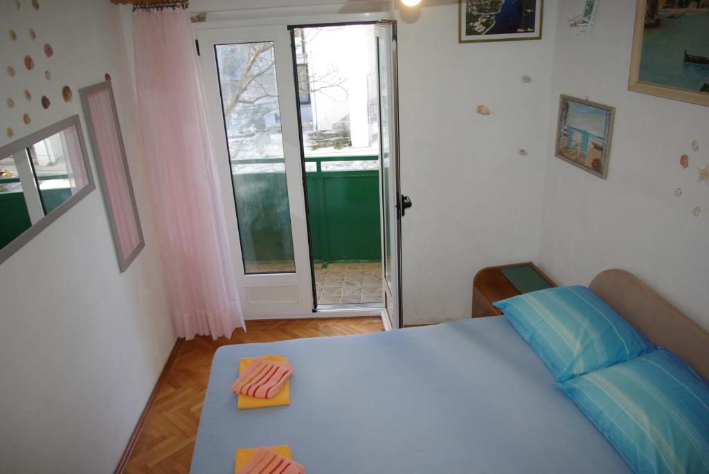 Postel nebo postele na pokoji v ubytování Rooms Tia