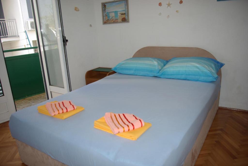 Postel nebo postele na pokoji v ubytování Rooms Tia