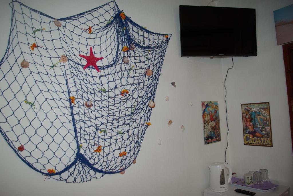 TV a/nebo společenská místnost v ubytování Rooms Tia