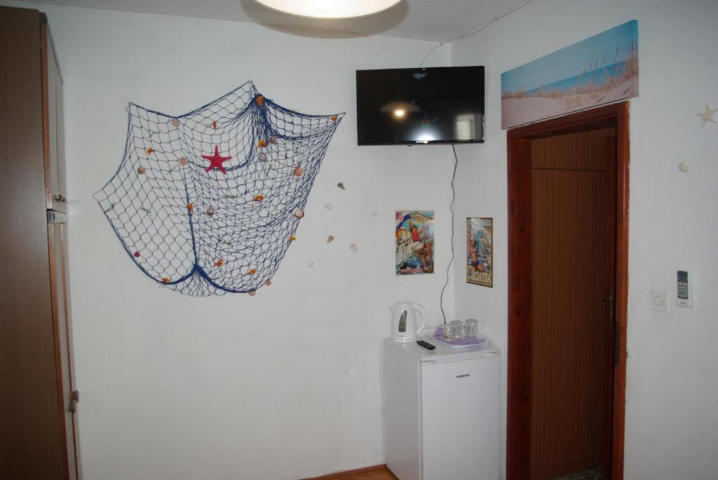 TV a/nebo společenská místnost v ubytování Rooms Tia