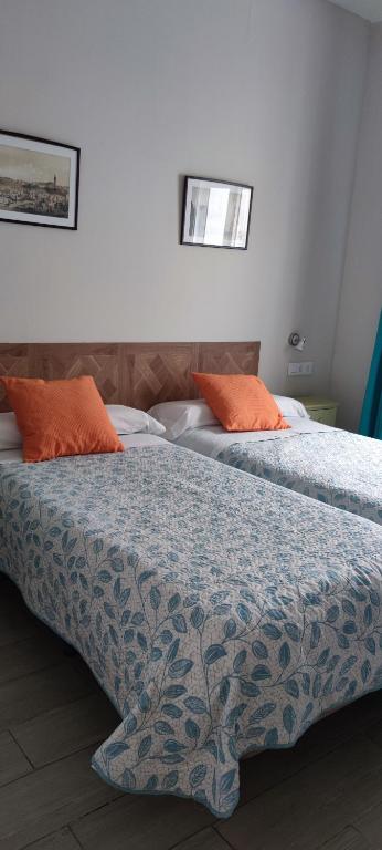 A bed or beds in a room at Centro de Sevilla