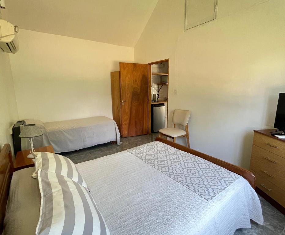 Ein Bett oder Betten in einem Zimmer der Unterkunft Bungalows Bella Vista