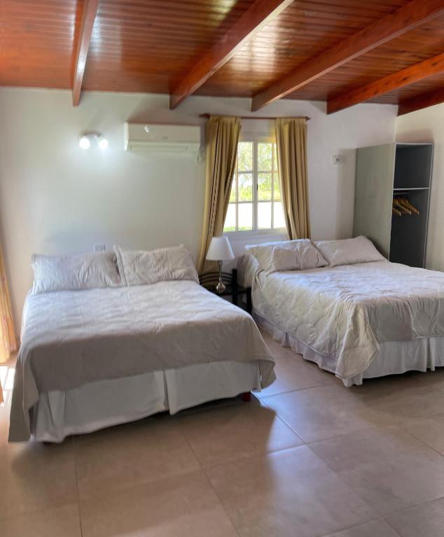 Ein Bett oder Betten in einem Zimmer der Unterkunft Bungalows Bella Vista