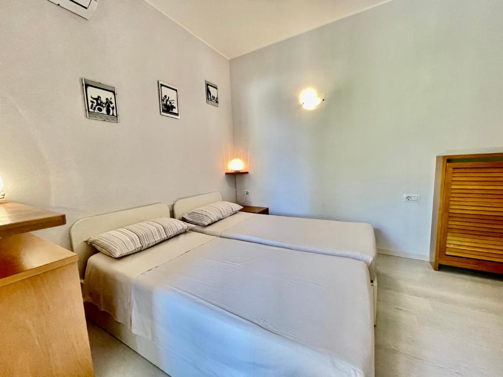 Postel nebo postele na pokoji v ubytování Eden sul Lago di Como