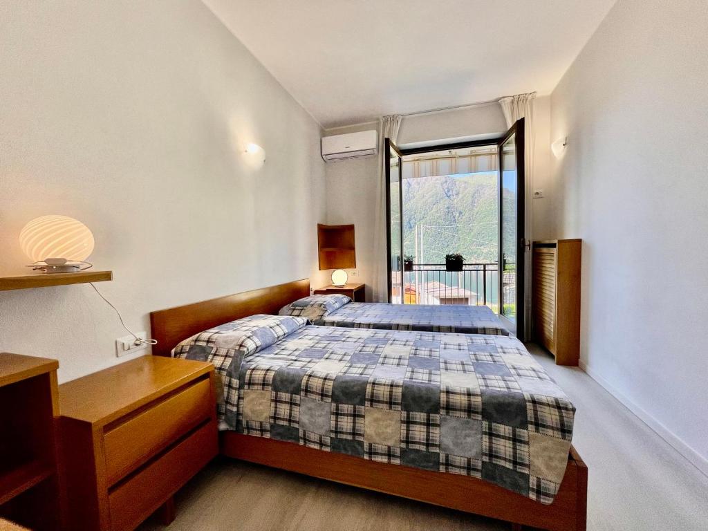 Postel nebo postele na pokoji v ubytování Eden sul Lago di Como