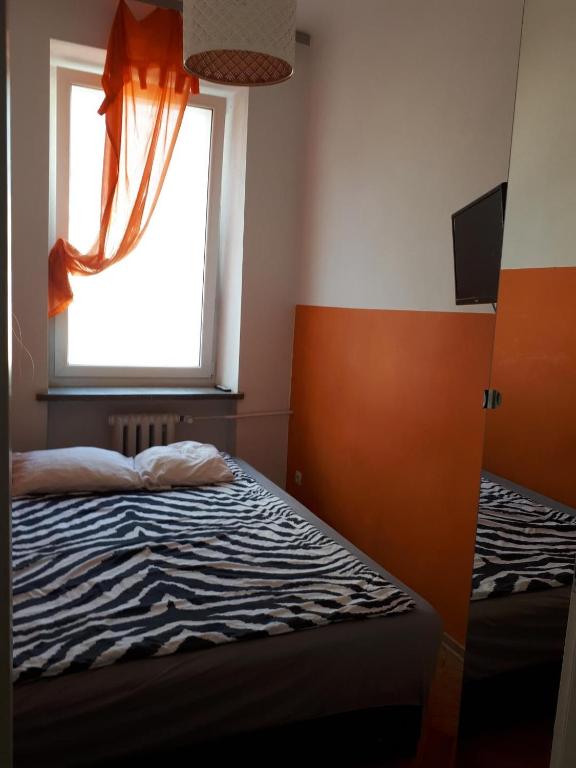 Posteľ alebo postele v izbe v ubytovaní Central Warsaw Apartment