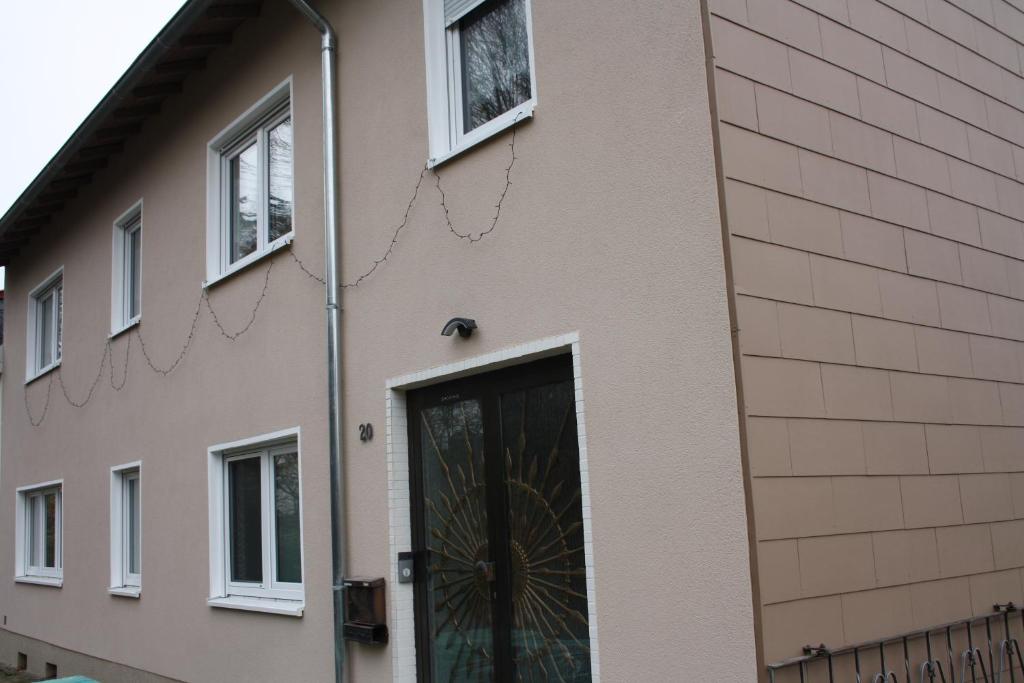 a building with a door with a spiderweb at Chiaras Ferienwohnung in Heusweiler