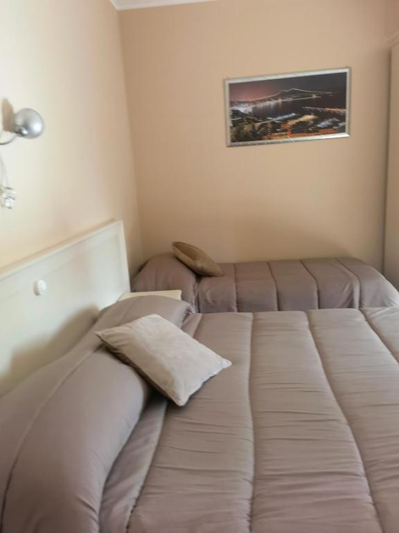 Łóżko lub łóżka w pokoju w obiekcie Fiumicino Inn Airport