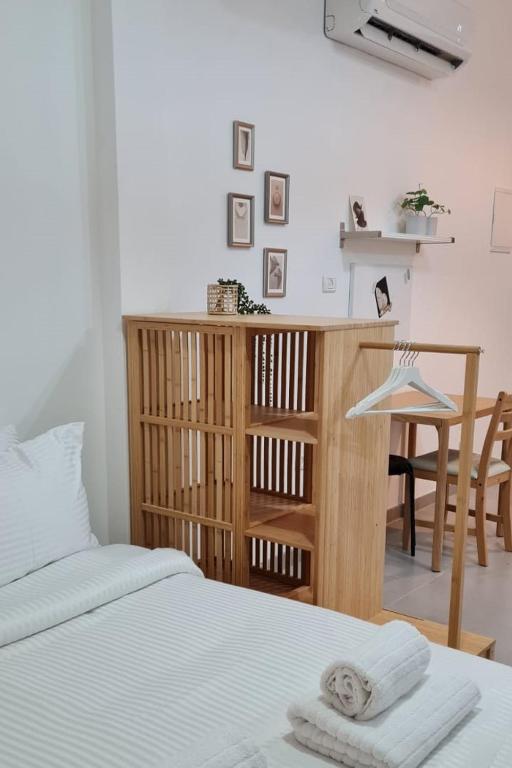 a bedroom with a bed and a table and a desk at Desert Shine in Qiryat Gat