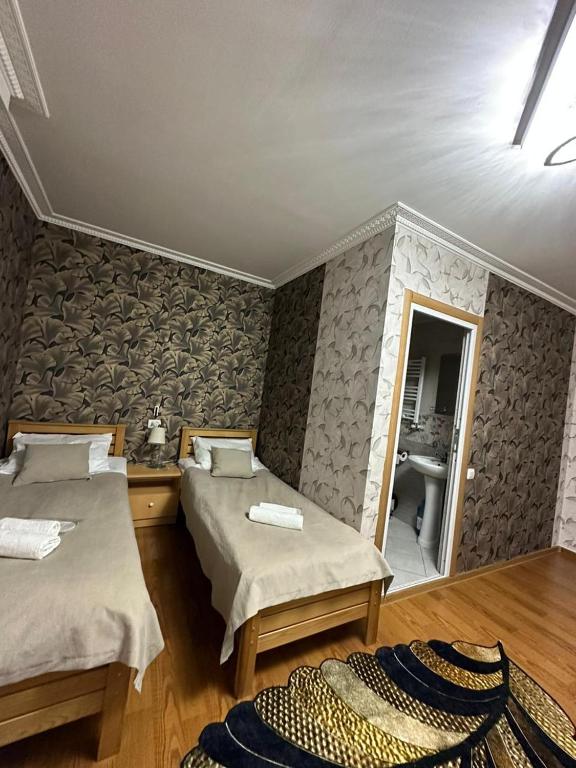 Postel nebo postele na pokoji v ubytování Guest House Elguja Qushashvili