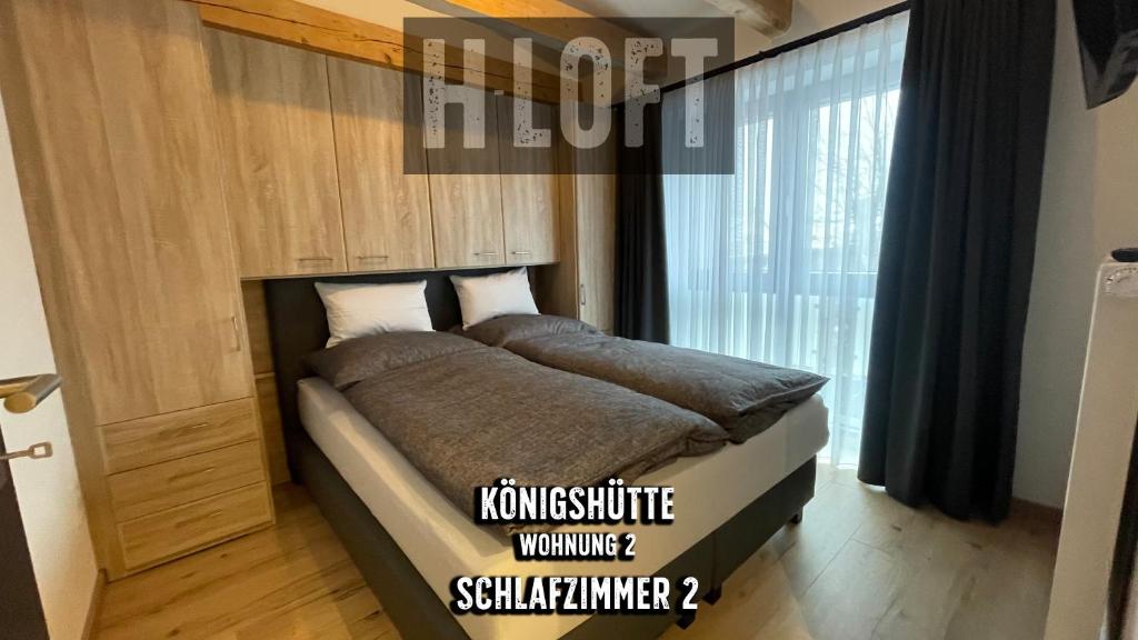Postel nebo postele na pokoji v ubytování H-Loft Style Apartments