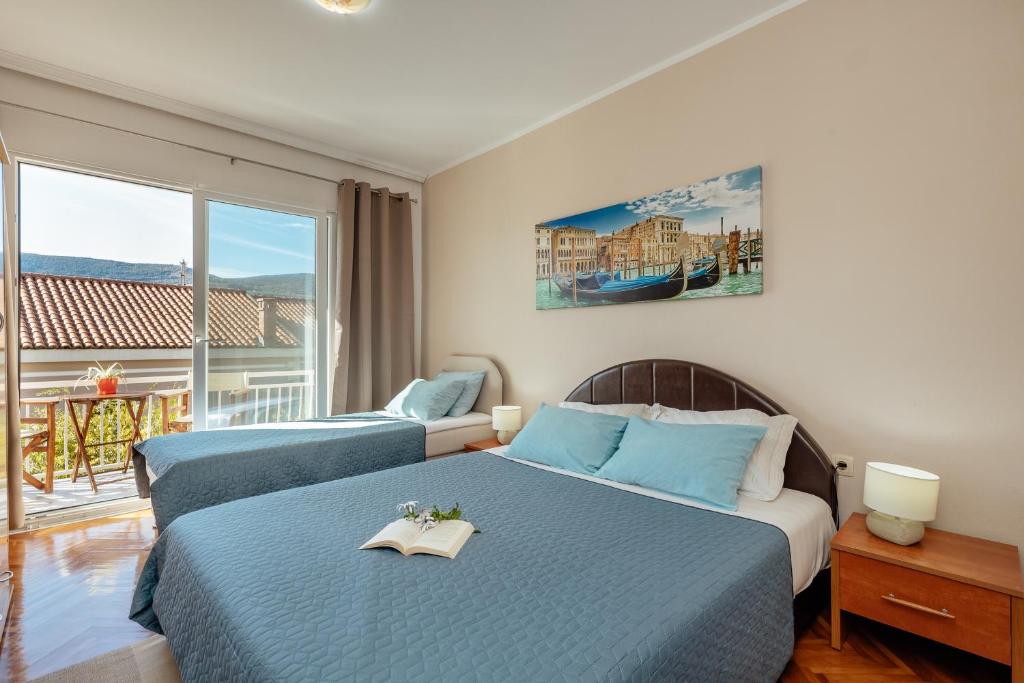 Postel nebo postele na pokoji v ubytování Apartmani Vico