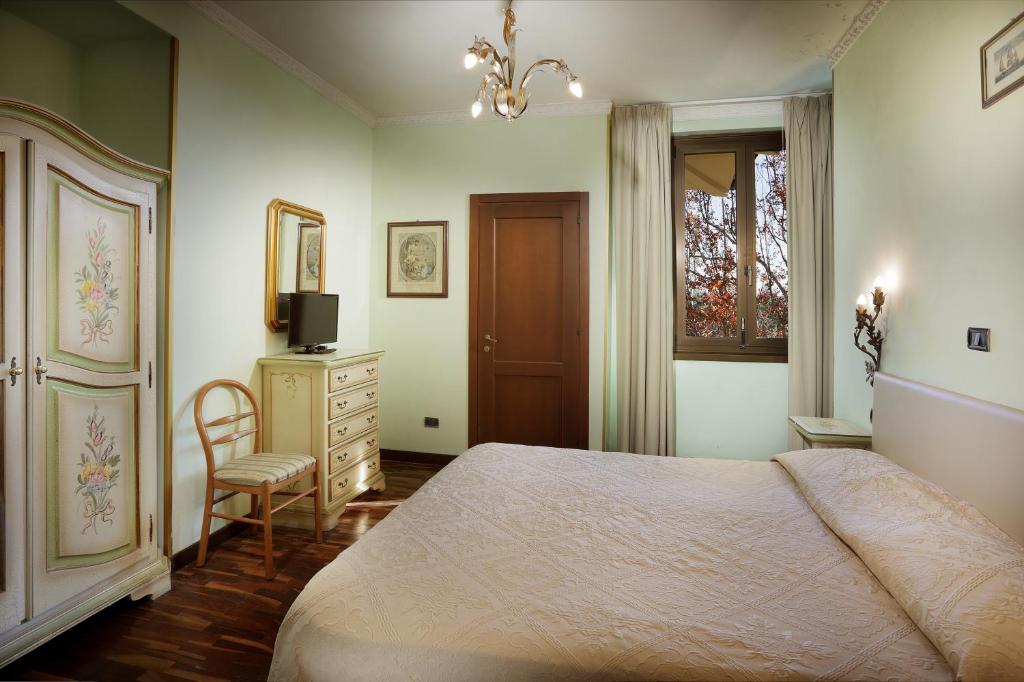 Postel nebo postele na pokoji v ubytování Hotel Savona