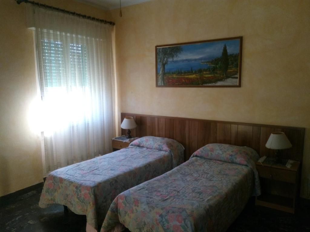 Postel nebo postele na pokoji v ubytování Hotel Lea
