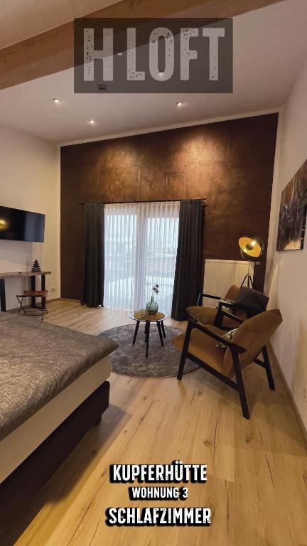 Postel nebo postele na pokoji v ubytování H-Loft Style Apartments