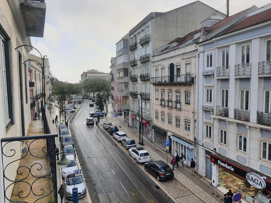 a view of a city street with parked cars and buildings at Graça Modern in Lisbon