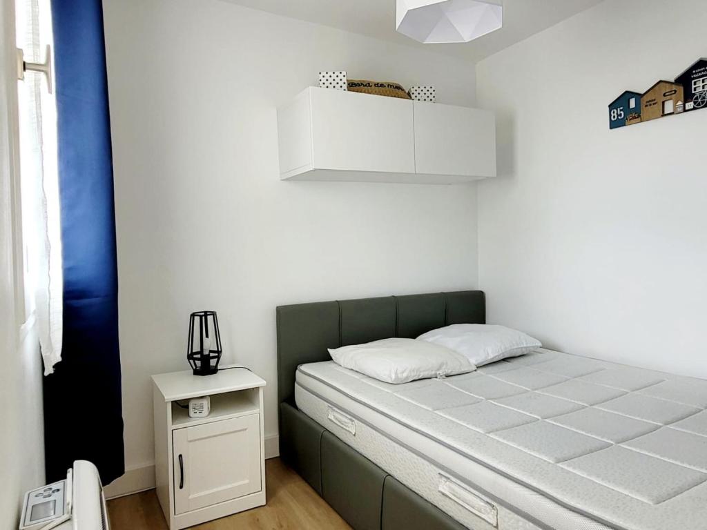 Posteľ alebo postele v izbe v ubytovaní CABOURG PLAGE