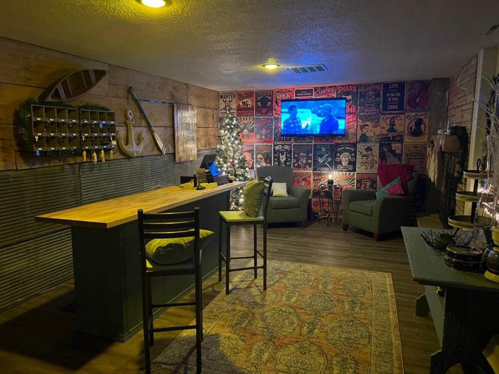 a kitchen with a bar and a living room at Buddy's Harbor in Lake Ozark