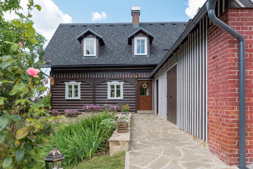 a renovation of a house with a brick building at Exkluzivní chalupa Podještědka s grilem a saunou in Světlá pod Ještědem