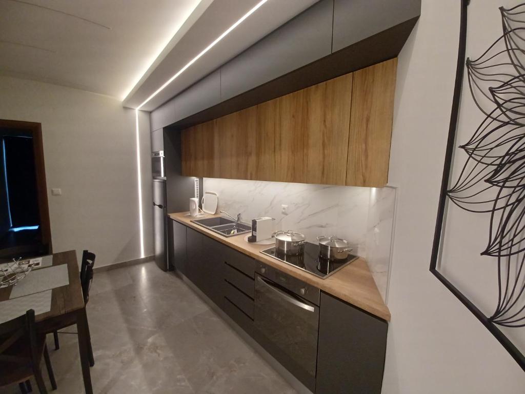 Kuchyň nebo kuchyňský kout v ubytování Top View Apartment