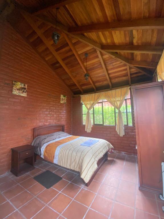 Postel nebo postele na pokoji v ubytování Hospedaje Pondoa - Baños de Agua