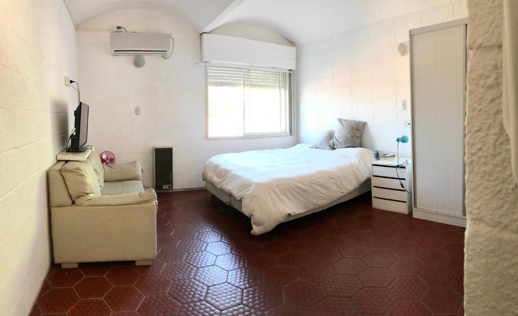 Una cama o camas en una habitación de Duplex centro Carlos Paz
