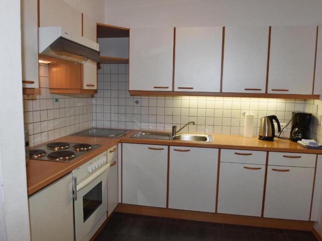 Kuchyň nebo kuchyňský kout v ubytování Nice apartment in Samnaun with garden