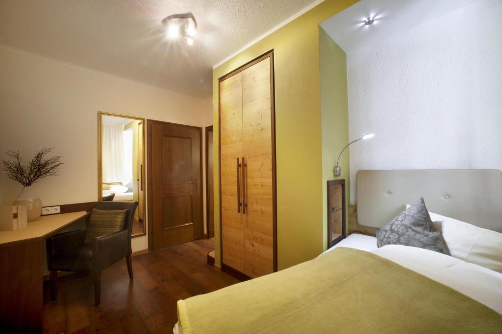Postel nebo postele na pokoji v ubytování Hotel Bergblick