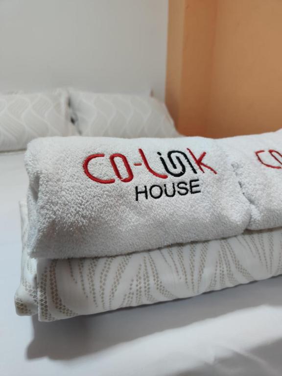Postel nebo postele na pokoji v ubytování CoLinkHouse Hotel