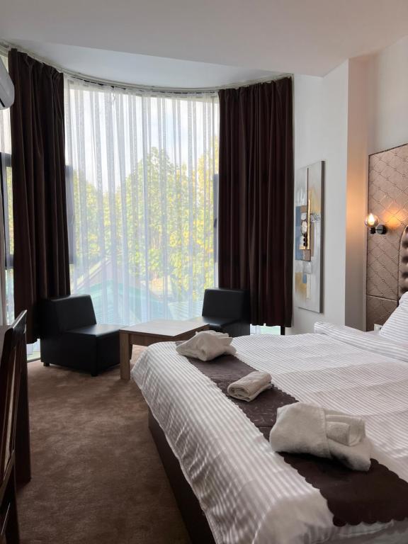 Postel nebo postele na pokoji v ubytování Hotel Andalus