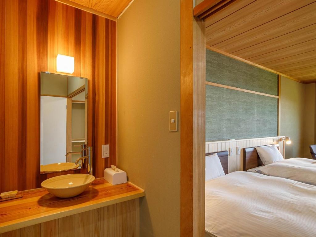 Postel nebo postele na pokoji v ubytování Hotel Iwasuge