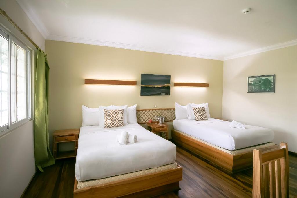 Llit o llits en una habitació de Gran Hotel Bahia