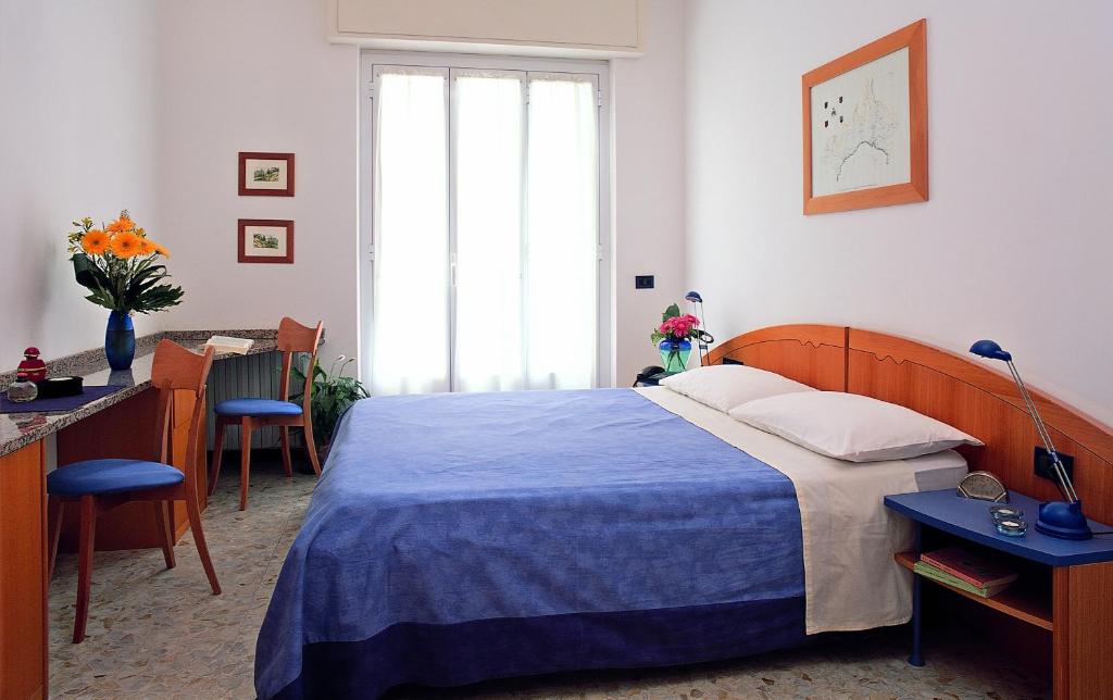 Postel nebo postele na pokoji v ubytování Residenza Adelaide