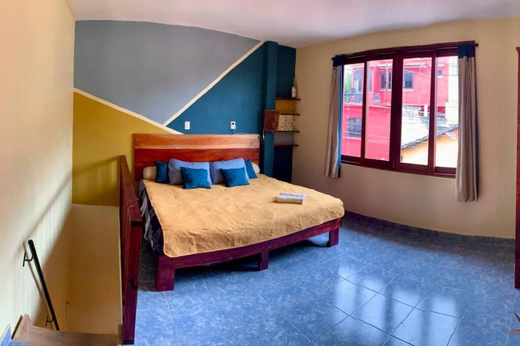 Ένα ή περισσότερα κρεβάτια σε δωμάτιο στο Hostal 23 - Departamento independiente