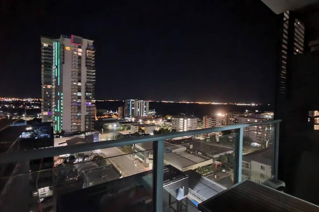 a view of a city at night from a balcony at Pandanas Apt 3 (Darwin CBD, Harbour views) in Darwin