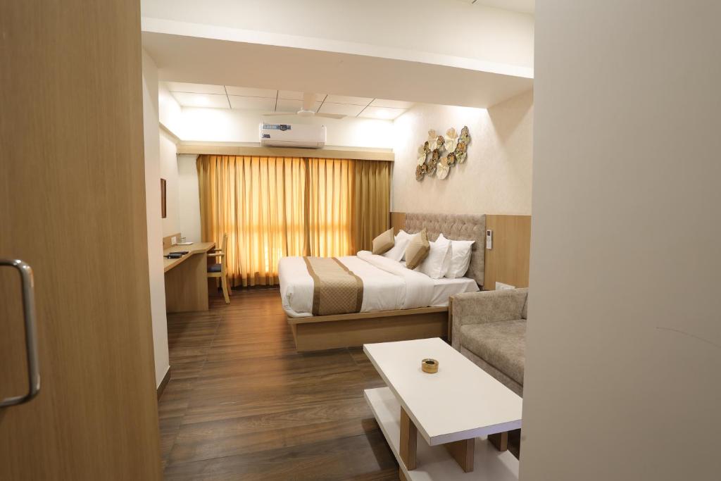 Postel nebo postele na pokoji v ubytování Hotel Lotus