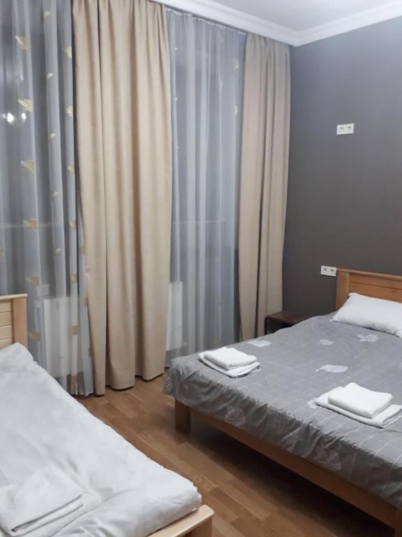 Postel nebo postele na pokoji v ubytování Sunflower Hotel