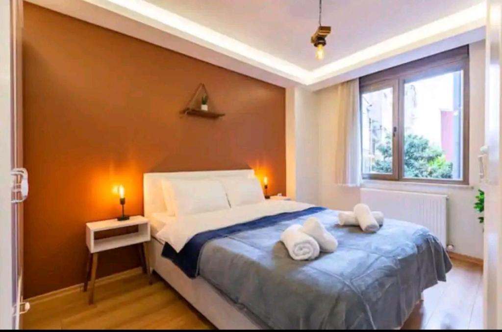 Кровать или кровати в номере Taksim beyoğlu