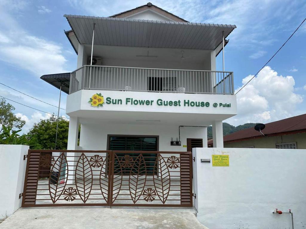 a building with a sunflower guest house at 15 min to Qing Xin Ling Cultural Village Ipoh in Ipoh