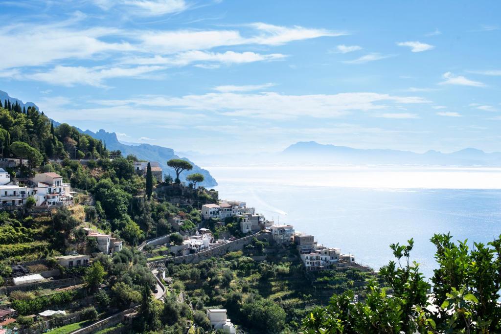 a town on a hill overlooking the ocean at LA CASA DI SAM in Amalfi