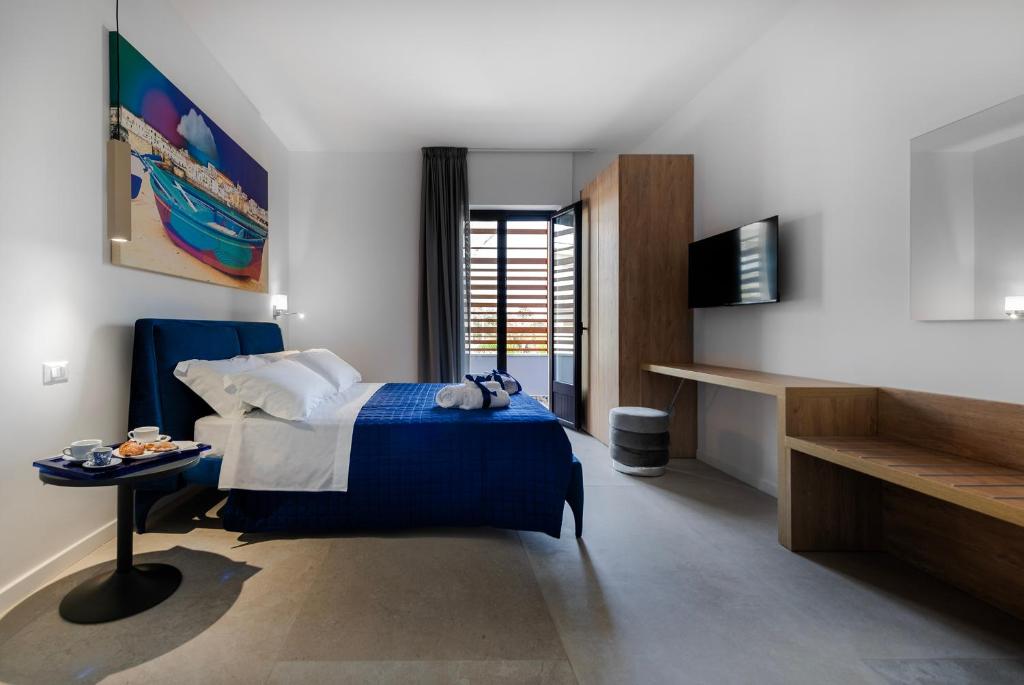 Postel nebo postele na pokoji v ubytování Azzurra Aparthotel