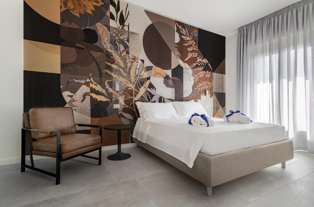 Postel nebo postele na pokoji v ubytování Azzurra Aparthotel