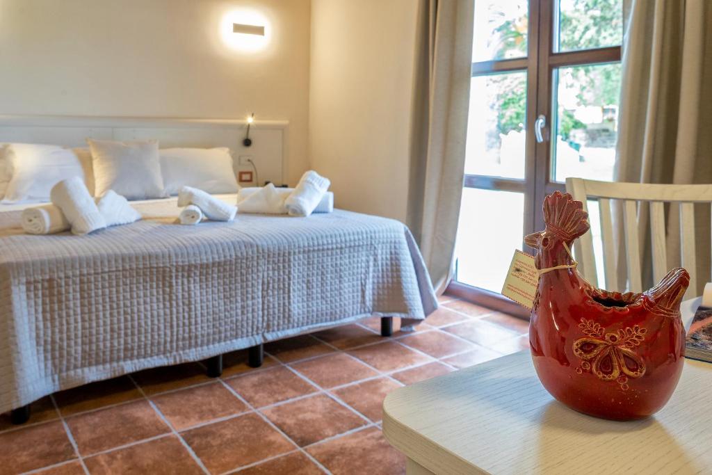 Posteľ alebo postele v izbe v ubytovaní Alghero Resort Country Hotel & Spa