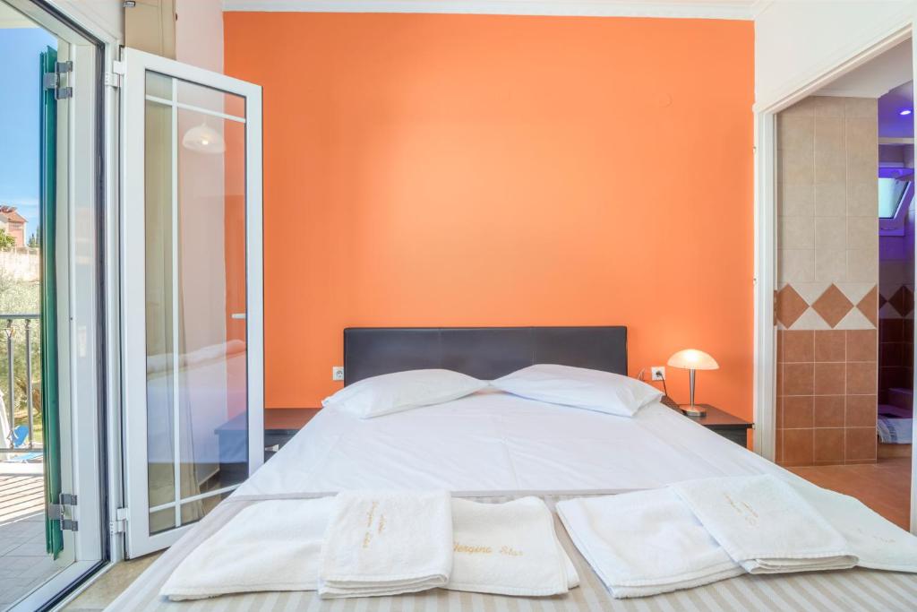 Postel nebo postele na pokoji v ubytování Vergina Star Hotel